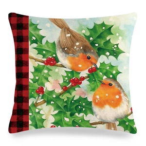 Detailed texture of linen pillowcase with robin birds on holly branch and red plaid trim