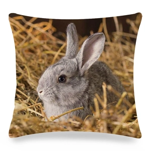 Detailed texture of linen cushion cover featuring realistic gray rabbit in hay print