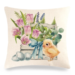 Detail of Easter linen pillowcase showing watercolor tulips, chicken and rustic fabric texture