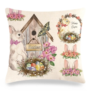 Close-up of Easter linen pillowcase with bunnies, birdhouse and floral print details