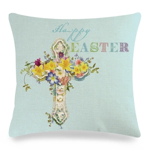 Close-up of Easter linen cushion cover with cross and Happy Easter floral text print