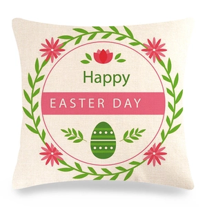 Detail of linen Easter pillow cover featuring a floral wreath and Happy Easter Day text