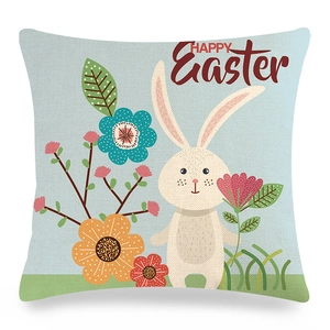 Detail of linen Easter cushion cover with cartoon bunny floral patterns and Happy Easter text