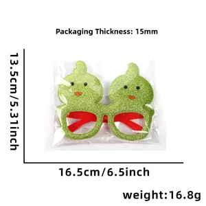 Vue détaillée des lunettes de Pâques à paillettes vertes en forme de poussin de 13,5cm