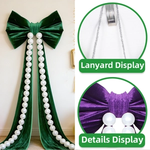 Detail of velvet bow hanging decoration with large pearls and lanyard for wedding decor