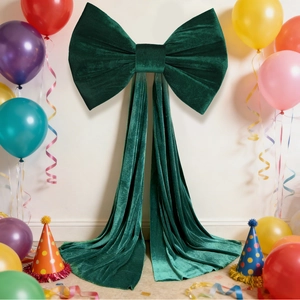 Deep green velvet oversized bow decoration with long ribbons for party backdrop