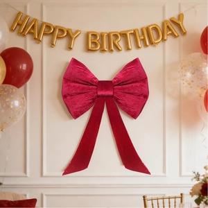 Large red velvet bow backdrop decoration with pearls for wedding and party settings