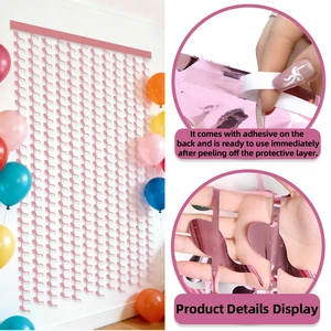 Detail of pink foil fringe curtain showing the self-adhesive backing for party decoration