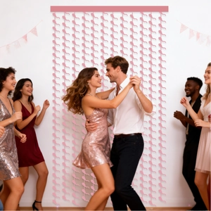 Pink heart shaped fringe curtain backdrop for bachelorette and bridal shower party decor