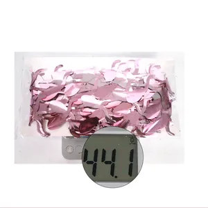 Pink flamingo party curtain packed on white card weighing 44.1g on a digital scale