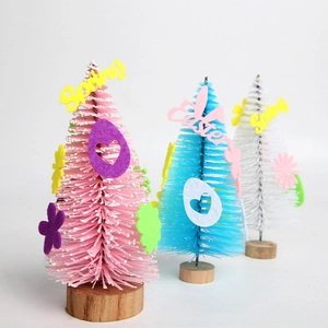 Three mini Easter sisal trees with colorful felt decors on natural wood bases