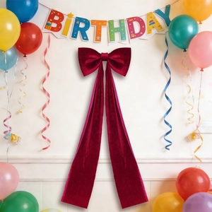 Large burgundy velvet bow decoration for wedding party and festive wall background decor