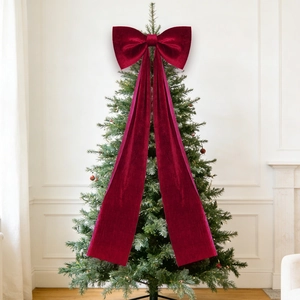Detail of large red velvet bow ornament for Christmas tree and wedding festive decoration
