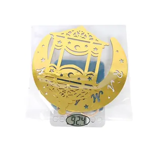 Detailed view of golden moon ornament on a digital scale showing weight of 92.4 grams