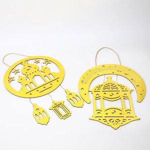 Detail view of yellow wooden Ramadan star moon and mosque ornaments for home decoration