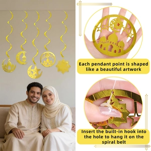 Golden spiral hanging swirl decorations with stars and mosque motifs for Eid party setup