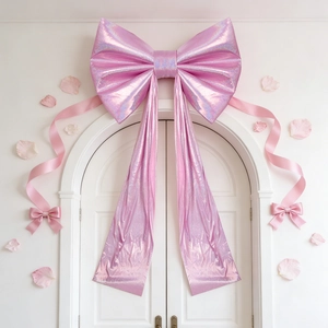 Giant laser pink decorative bow with long streamers for wedding and party venue layout