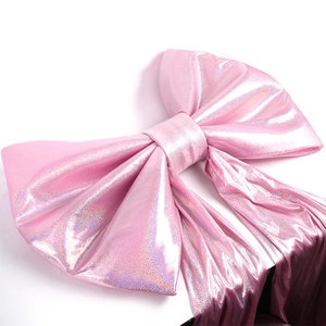 Detail of large pink bow with metallic shimmer fabric for wedding party decoration