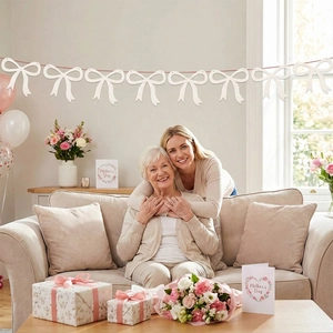 Close-up of glittery white felt bow bunting for Mother's Day party home wall decoration