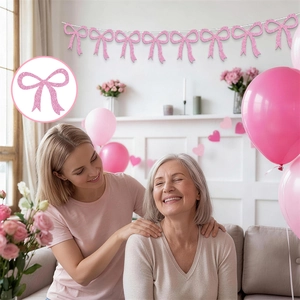 Close-up of glittery pink bow banner for Mother's Day party home wall decoration
