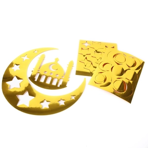 Detailed view of gold metallic moon and star window stickers for Ramadan DIY decoration