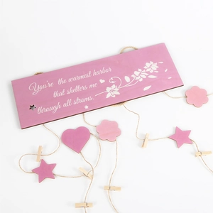 Wooden Mother's Day photo hanging display with heart tags and flower pattern art