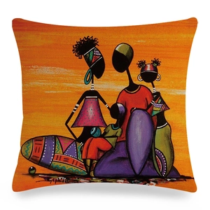 Detail of African tribal art print on linen cushion cover with colorful family portrait