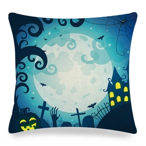 Detail of Halloween linen pillowcase showing a full moon and pumpkin on a blue background