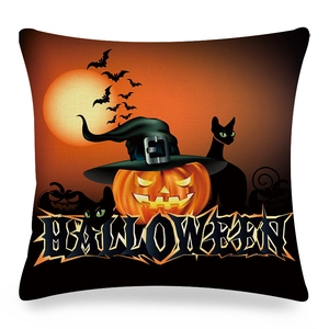 Detail of Halloween linen pillowcase featuring a pumpkin, black cat, and bats on white