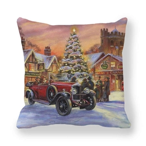 Detail of vintage Christmas pillowcase featuring a red car and festive snowy town scene