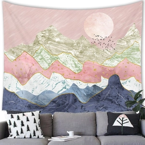Detail of abstract landscape tapestry featuring mountains and moon over a sofa