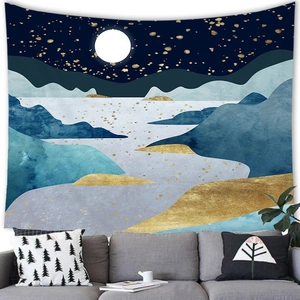 Detailed close-up of abstract mountain landscape tapestry hung above a modern gray sofa