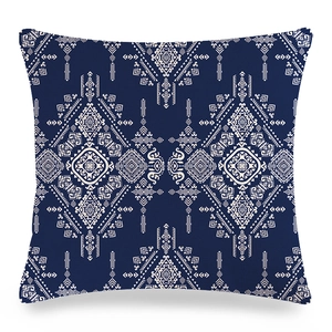 Macro detail of navy blue linen pillow case featuring bohemian geometric patterns