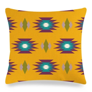 Macro detail of geometric linen pillow cover showing textured fabric and vivid diamond patterns