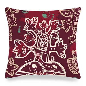 Abstract ethnic linen pillow cover in deep red featuring cream tree and eye illustrations