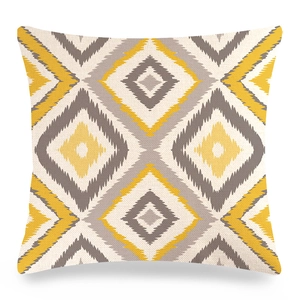 Detailed texture of geometric ikat diamond pillow cover in yellow and grey linen