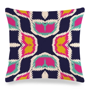 Close-up of geometric ethnic pattern print on textured linen cushion cover fabric