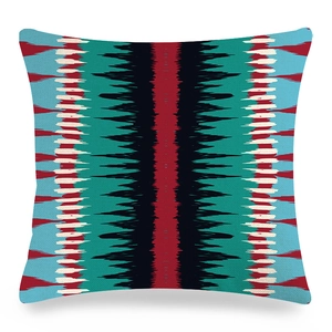 Detailed texture of linen cushion cover featuring geometric ethnic tie-dye patterns