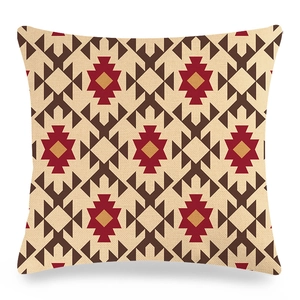 Detailed macro view of woven linen texture and tribal geometric patterns on a cushion cover