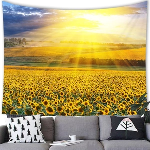 Detail of sunflower tapestry hanging on wall above a grey sofa for home decor
