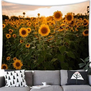 Detail showing sunset sunflower field tapestry hanging above a grey sofa in a living room