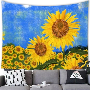 Macro shot of sunflower tapestry hanging over a grey sofa in a modern room
