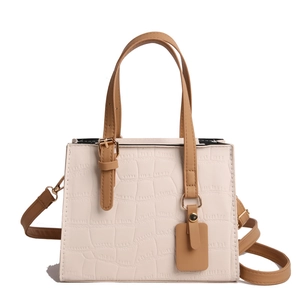 Chic beige crocodile pattern crossbody bag with brown handles and gold hardware
