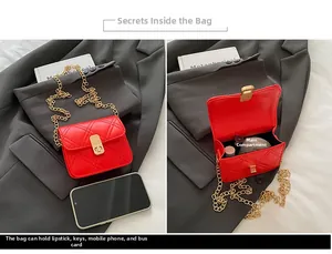Detailed interior of red quilted chain bag showing main pocket and gold clasp lock