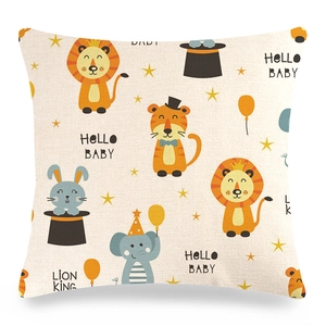 Detail of linen cushion cover showing cartoon lion and rabbit patterns with HELLO BABY print