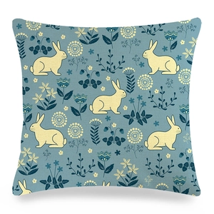 Linen Easter cushion cover with cartoon rabbit and floral motif on blue background