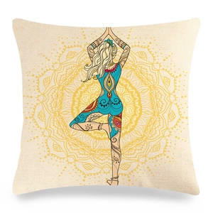 Macro detail of square linen pillowcase with mandala yoga print and tree pose illustration