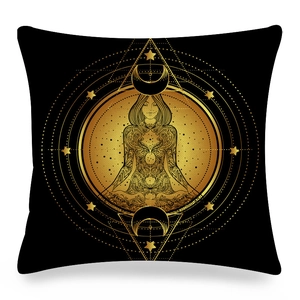 Detailed macro of golden mandala yoga pattern on black linen square pillowcase