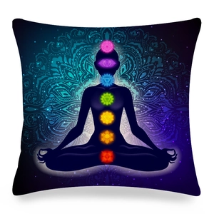 Macro detail of Mandala pillow cover featuring colorful Chakra symbols on linen fabric