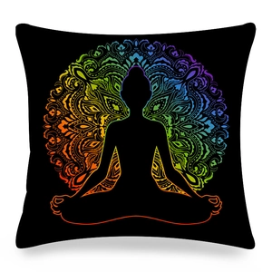 Detailed macro view of colorful mandala pattern and yoga silhouette on black cushion cover